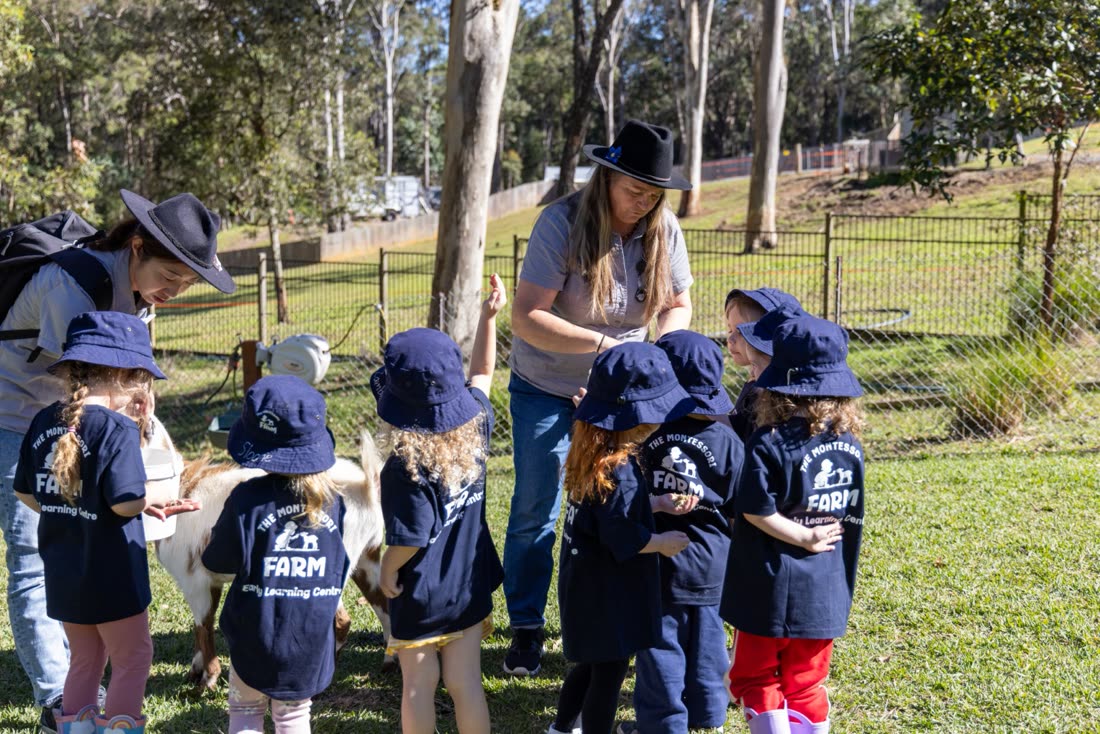 Children gathered with the Farmer by the paddock
