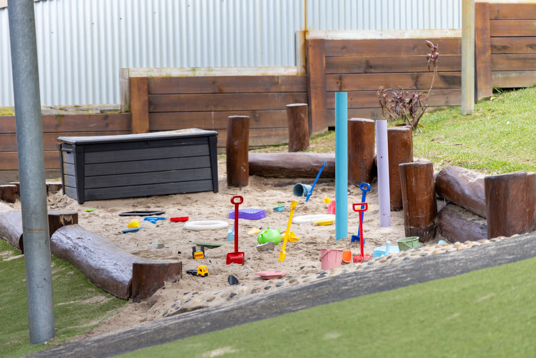 The sandpit with diggers and toys
